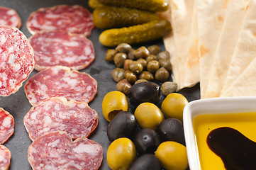 Image showing cold cut platter with pita bread and pickles