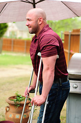 Image showing Man on crutches