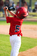 Image showing Baseball boy warming up to bat