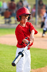 Image showing Boy warming up to bat