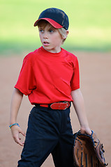 Image showing Little league baseball player looking sideways