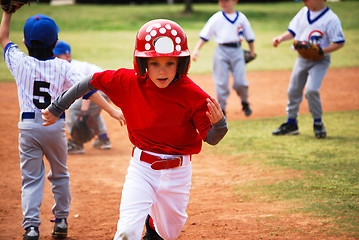 Image showing Little league baseball player running bases