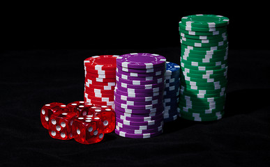 Image showing Stacks of Poker Chips with Playing Bones