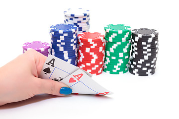 Image showing Hand with two Aces and Stacks Poker Chips