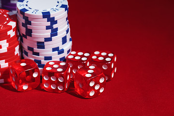 Image showing Stacks of Poker Chips with Playing Bones