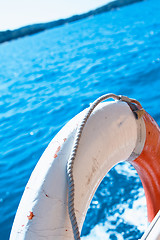 Image showing White life buoy on the boat fence