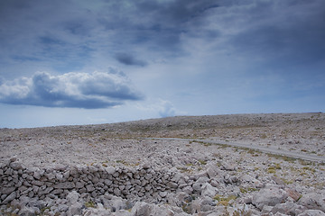 Image showing Beautiful rocky hill with aged stone wall ruins