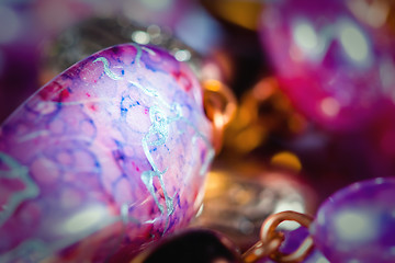 Image showing Hand made colorful earrings macro with shallow DOF.