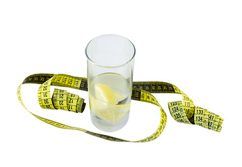 Image showing water with lemon in glass and yellow centimeter  