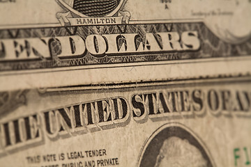 Image showing US dollars background, reto style toned photo with shallow DOF