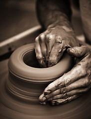 Image showing Hands working on pottery wheel