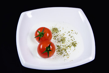 Image showing Milky soup with tiny red tomatoes