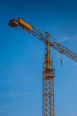 Image showing yellow construction crane  on building site
