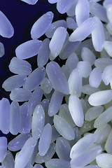 Image showing Rice  on black background under neon light