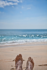 Image showing Feet on a sand beach