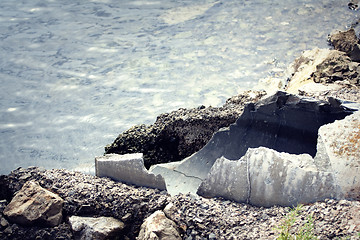 Image showing Old pipes with wastewater going into the sea