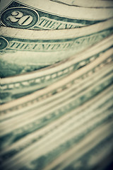 Image showing US dollars background, reto style toned photo with shallow DOF