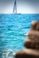 Image showing Sailboat near the coast on a sunny day