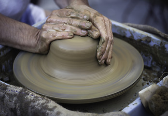 Image showing Hands working on pottery wheel