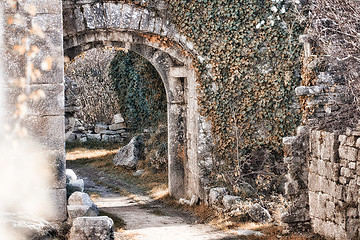 Image showing Old castle backyard with stone arches