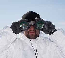 Image showing Special Forces soldier in white camouflage looking through binoc