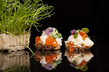 Image showing Salmon, cheese, and herbs canapes