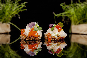 Image showing fresh salmon, cheese, and herbs canapes