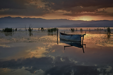 Image showing Fishing boat at rising sun