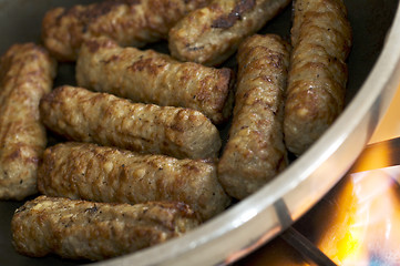 Image showing cooking sausages in a pan