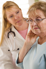 Image showing Senior Adult Woman Being Consoled by Female Doctor or Nurse