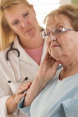 Image showing Senior Adult Woman Being Consoled by Female Doctor or Nurse