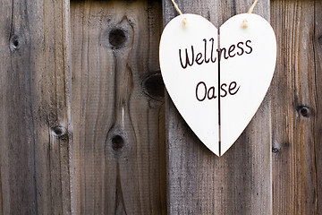 Image showing Wooden fence and wellness signboard