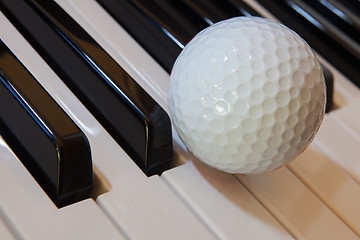 Image showing Golf and piano