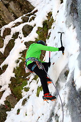Image showing mountaineer on ice wall