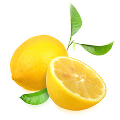 Image showing Fresh yellow lemons with green leaf