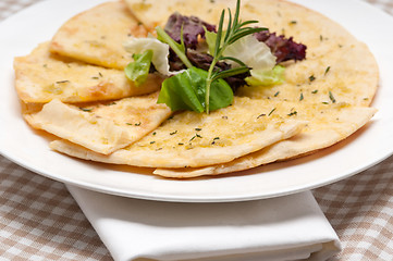 Image showing garlic pita bread pizza with salad on top