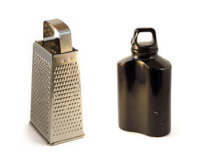 Image showing metal cheese grater and flask, black water  canteen isolated on white backgroundcloth