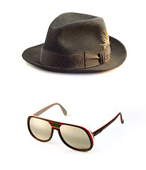 Image showing Retro sunglasses, Classic black  felt trilby/fedora hat isolated on a white background.