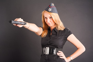 Image showing Pretty woman with a gun