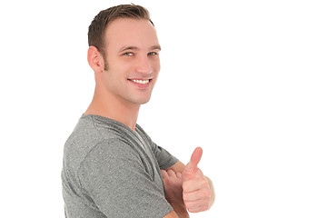 Image showing Casual smiling man showing thumb up