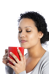 Image showing Woman enjoying a mug of coffee