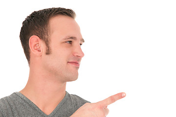 Image showing Smiling man pointing his finger