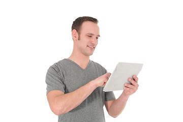 Image showing Casual man with his tablet