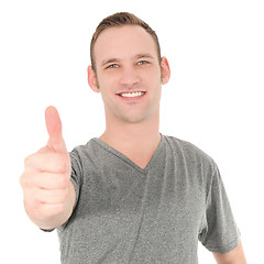 Image showing Smiling man showing thumb up