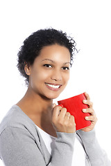 Image showing Smiling woman with red cup of coffee