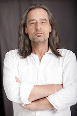 Image showing Serious man with shoulder length hair