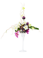 Image showing  Floral arrangement from artificial flowers in glass goblet isol