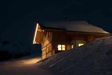 Image showing Beautiful skiing hut at  night