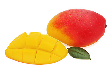 Image showing Fresh mango fruit with cut and green leaves isolated on white ba