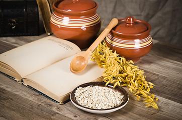 Image showing  Still life with oatmeal and an open book